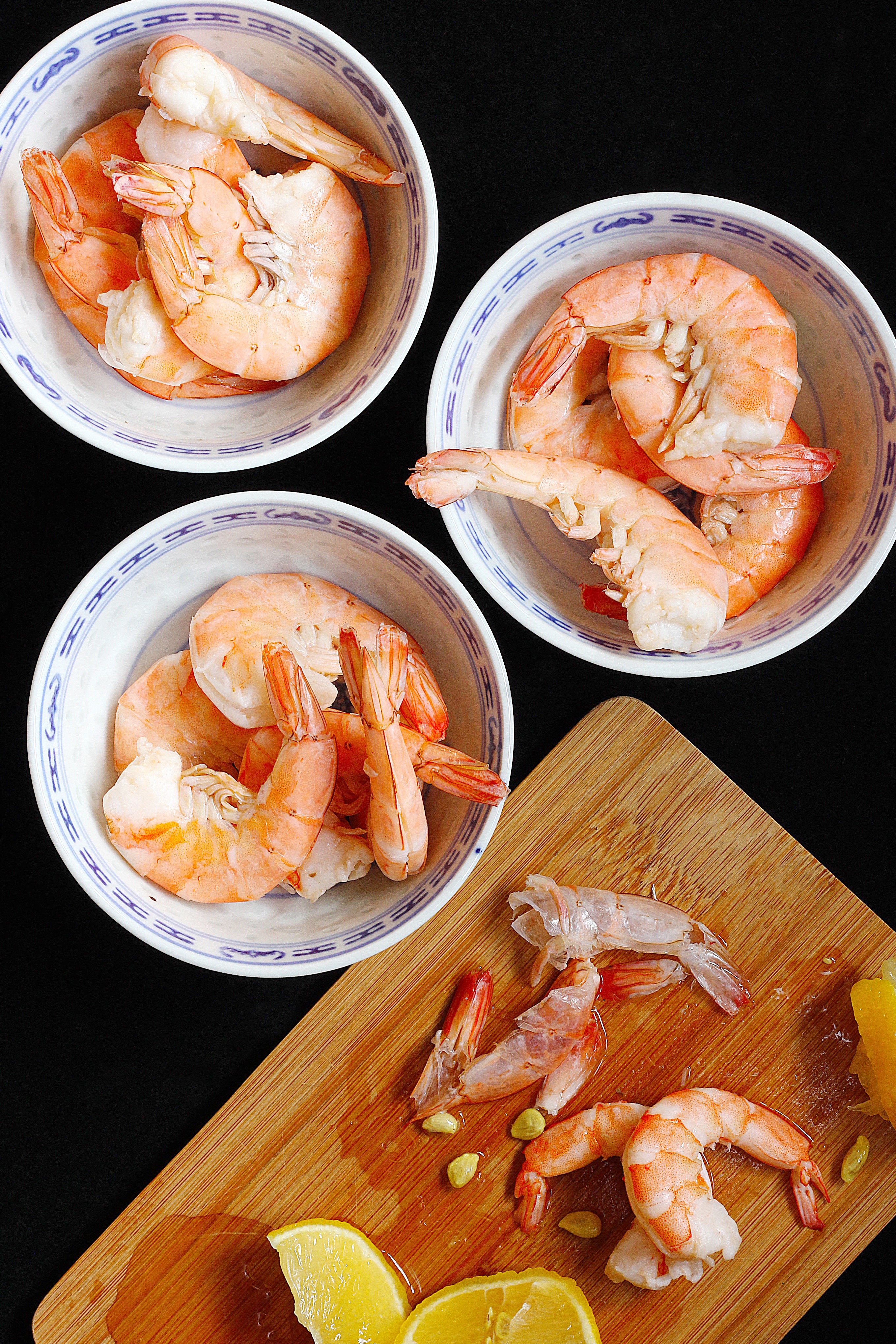 cooked-shrimp-dressed-with-lemon-juice-in-china-bowls.jpg